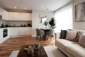 modern open plan living dining and kitchen area with elegant furniture and abstract art